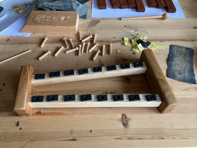 The partially assembled xylophone, showing the foam tape that lets the keys vibrate.